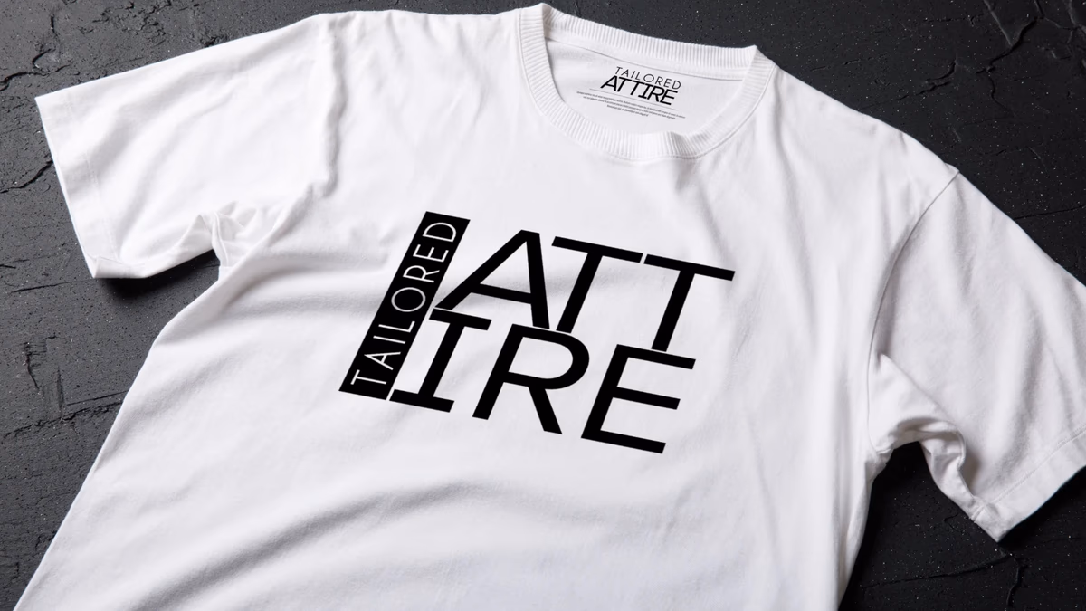 Tailored Attire branded shirt mockup showing the wordmark applied to a clean menswear garment, designed by Desque
