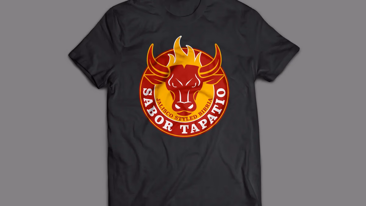 Sabor Tapatio brand identity applied to a black t-shirt, showing the circular bull badge logo designed by Desque