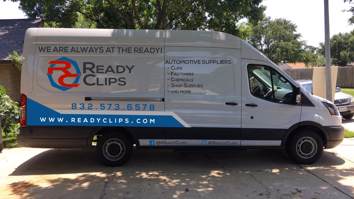 Ready Clips branded delivery van side wrap designed by Desque, red and blue fleet identity