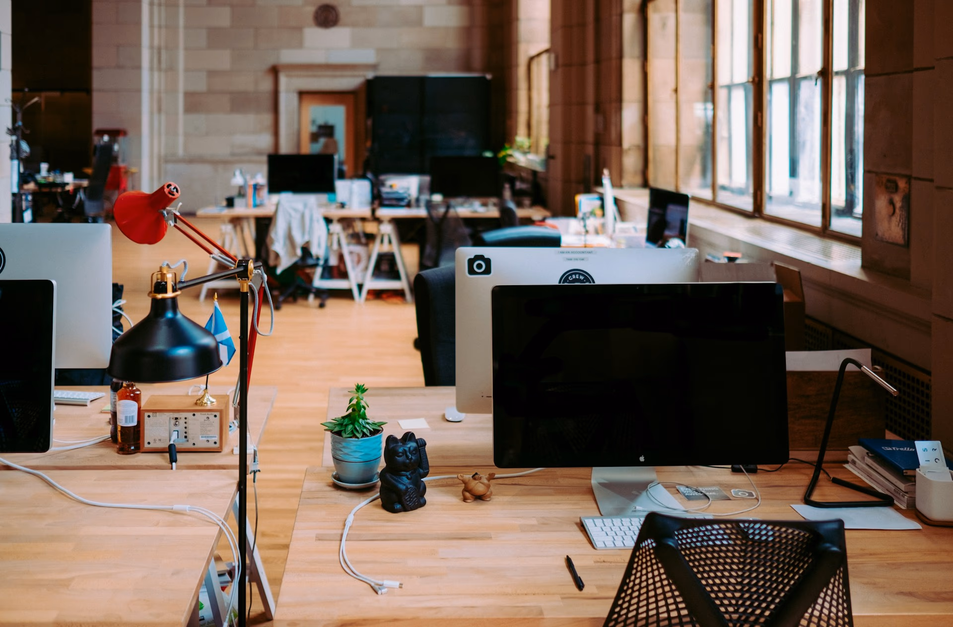 A bright, open creative studio with designers' desks and daylight