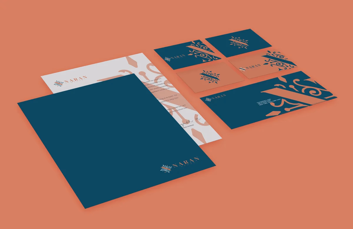 Naran Group stationery suite mockup showing folders and business cards designed by Desque
