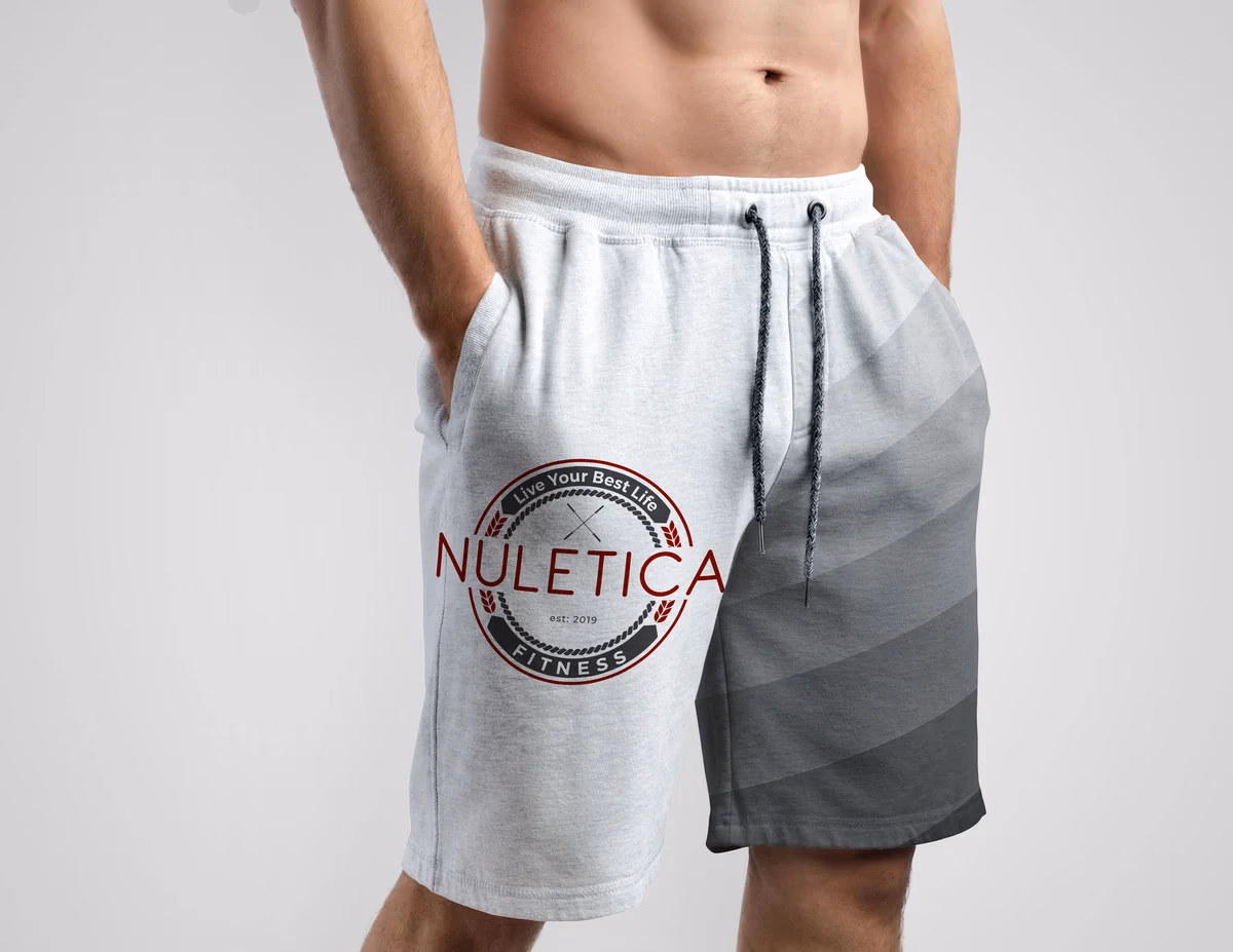 Nuletica Fitness logo printed on athletic shorts apparel mockup, designed by Desque