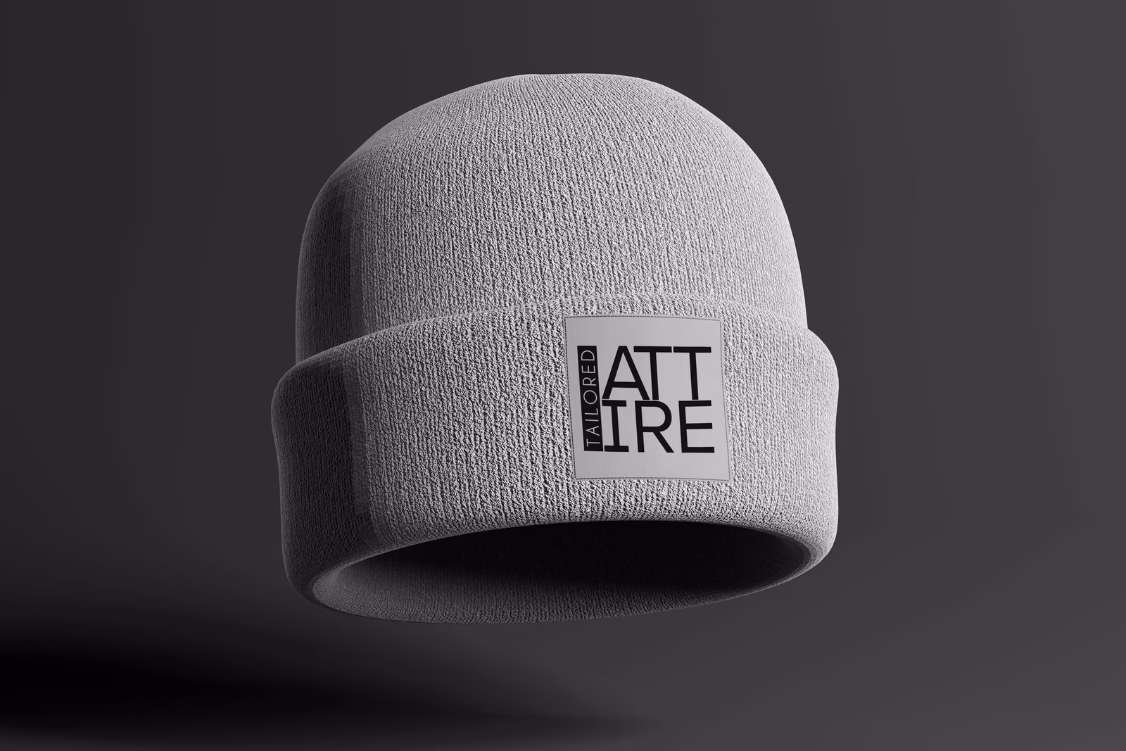 Tailored Attire embroidered beanie mockup designed by Desque, testing the iconic mark at small embroidery scale