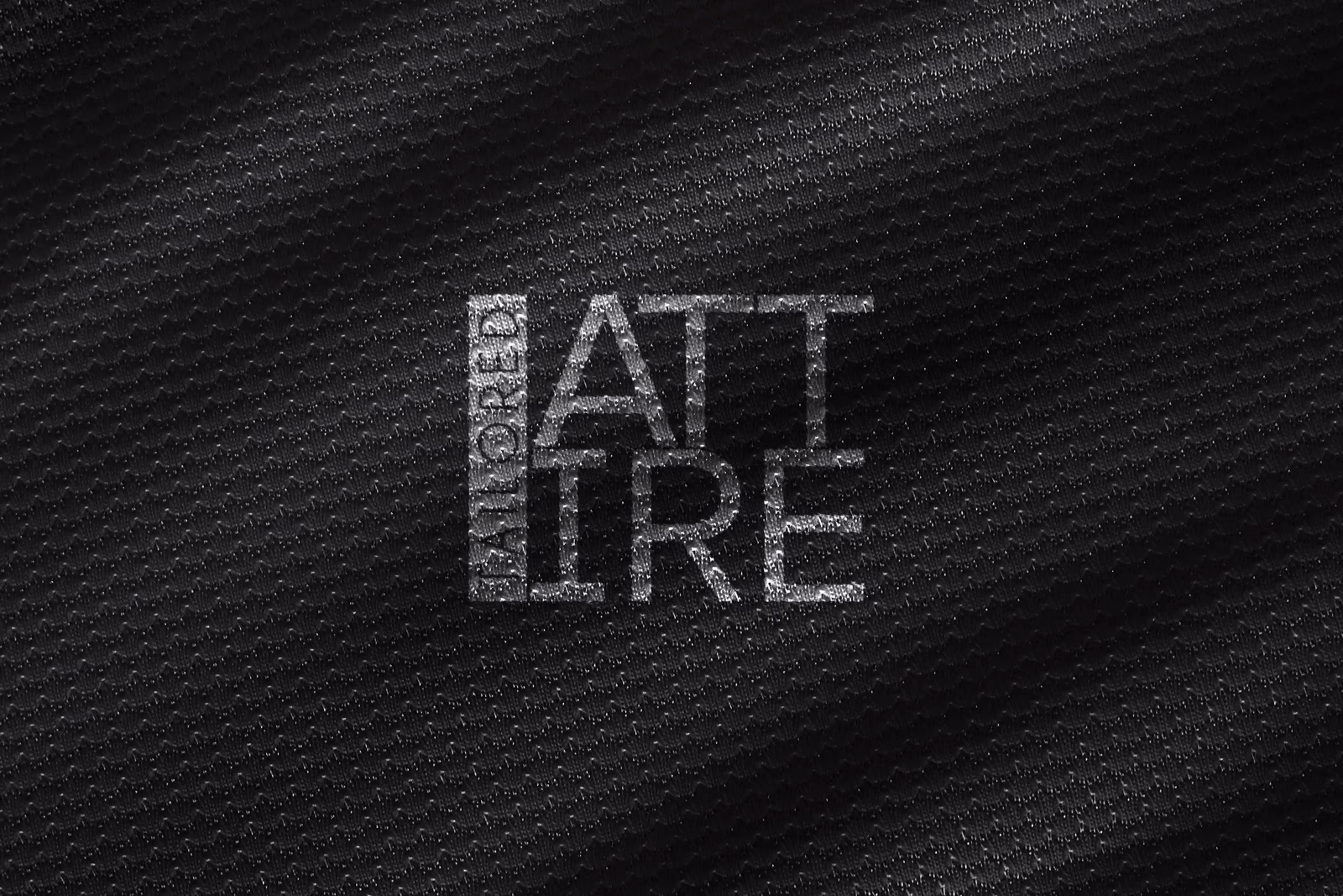 Tailored Attire logo applied to a branded apparel mockup designed by Desque