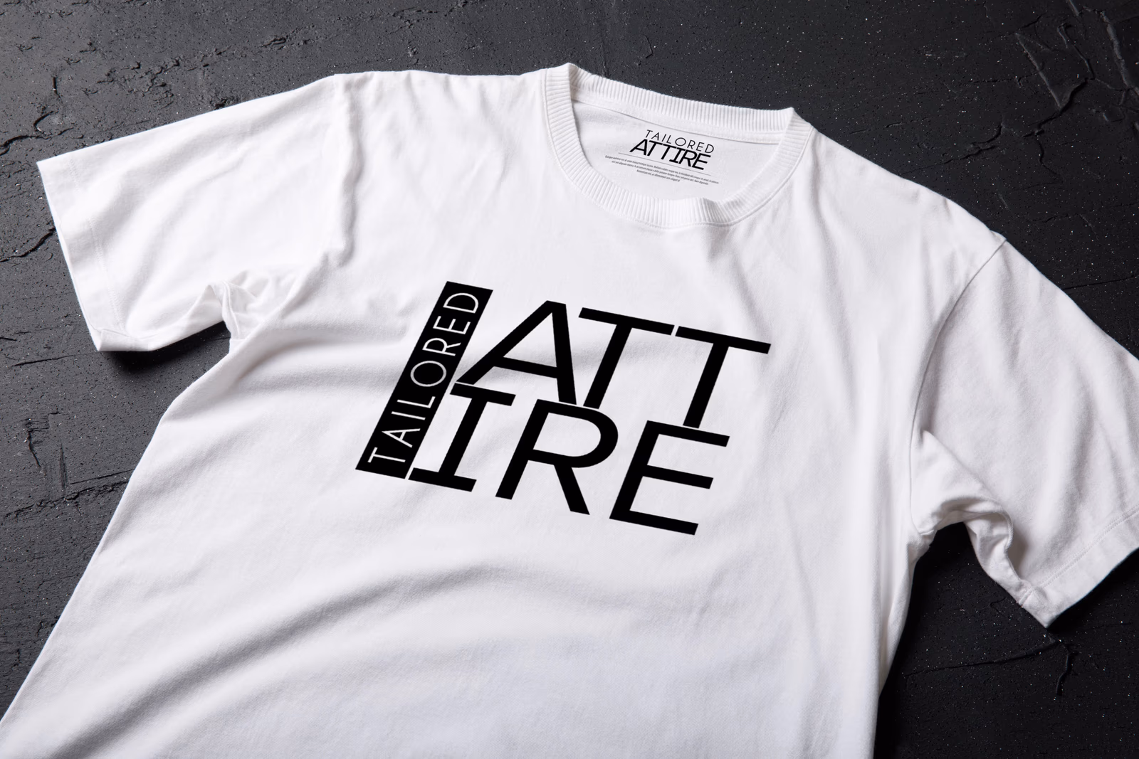 Tailored Attire wordmark printed on a shirt mockup designed by Desque, showing garment branding in context