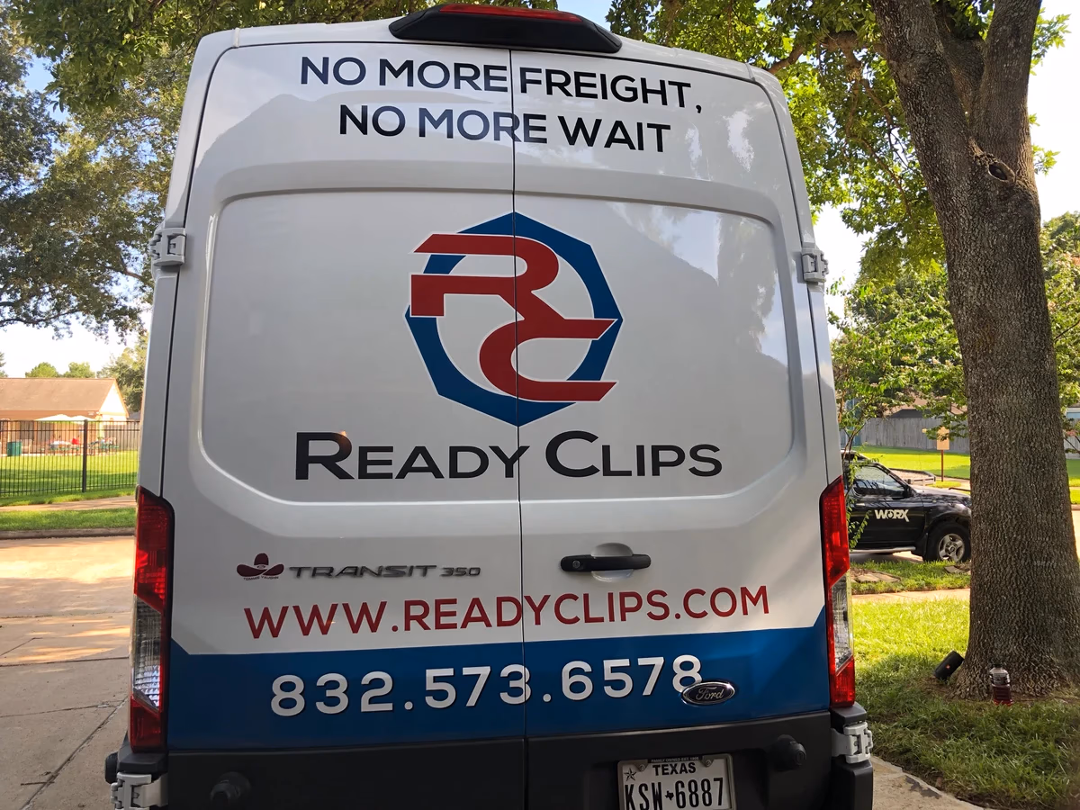 Ready Clips branded delivery van in the field, Desque fleet branding applied