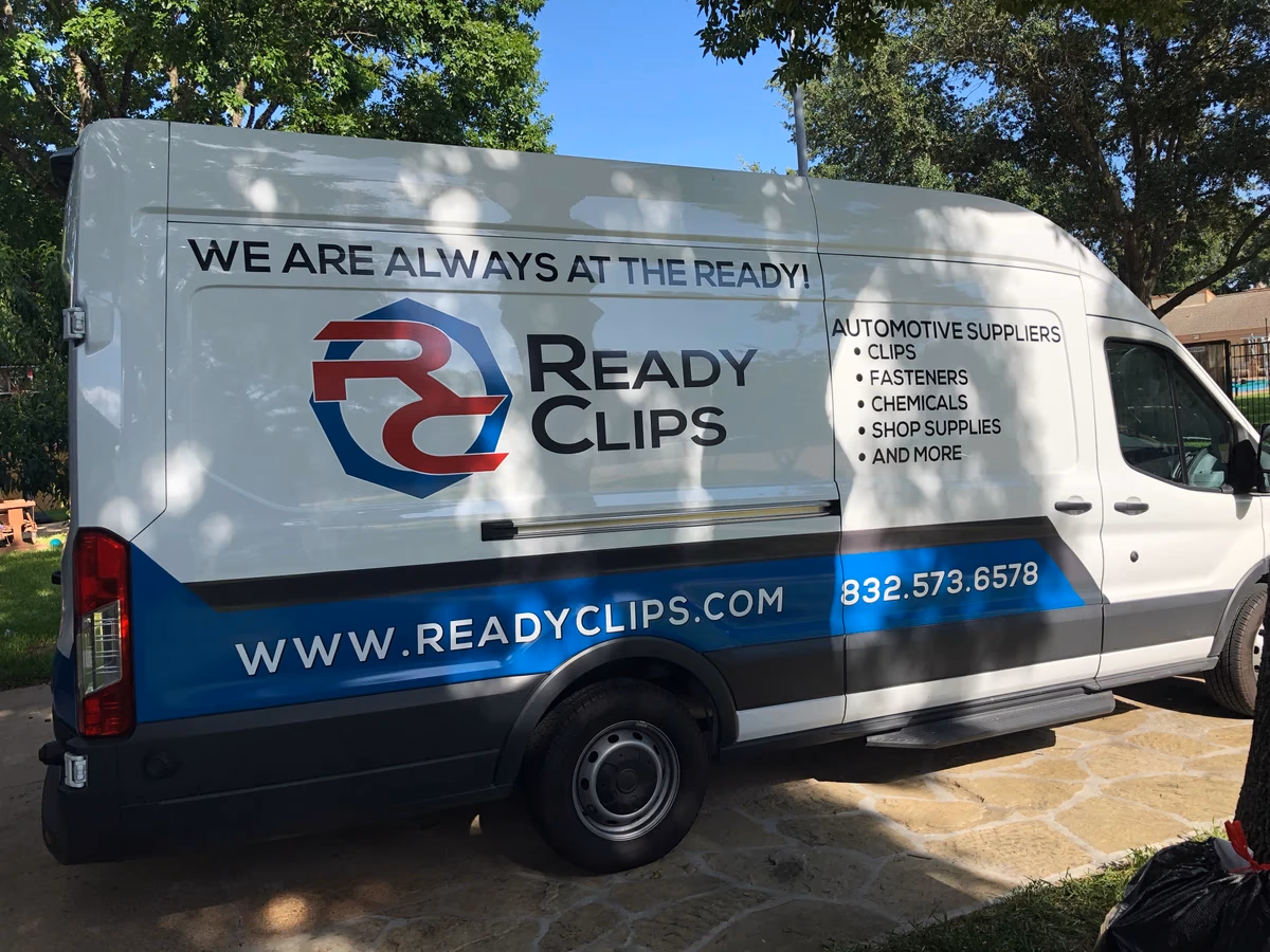 Ready Clips branded van exterior showing Desque vehicle wrap system in real-world environment