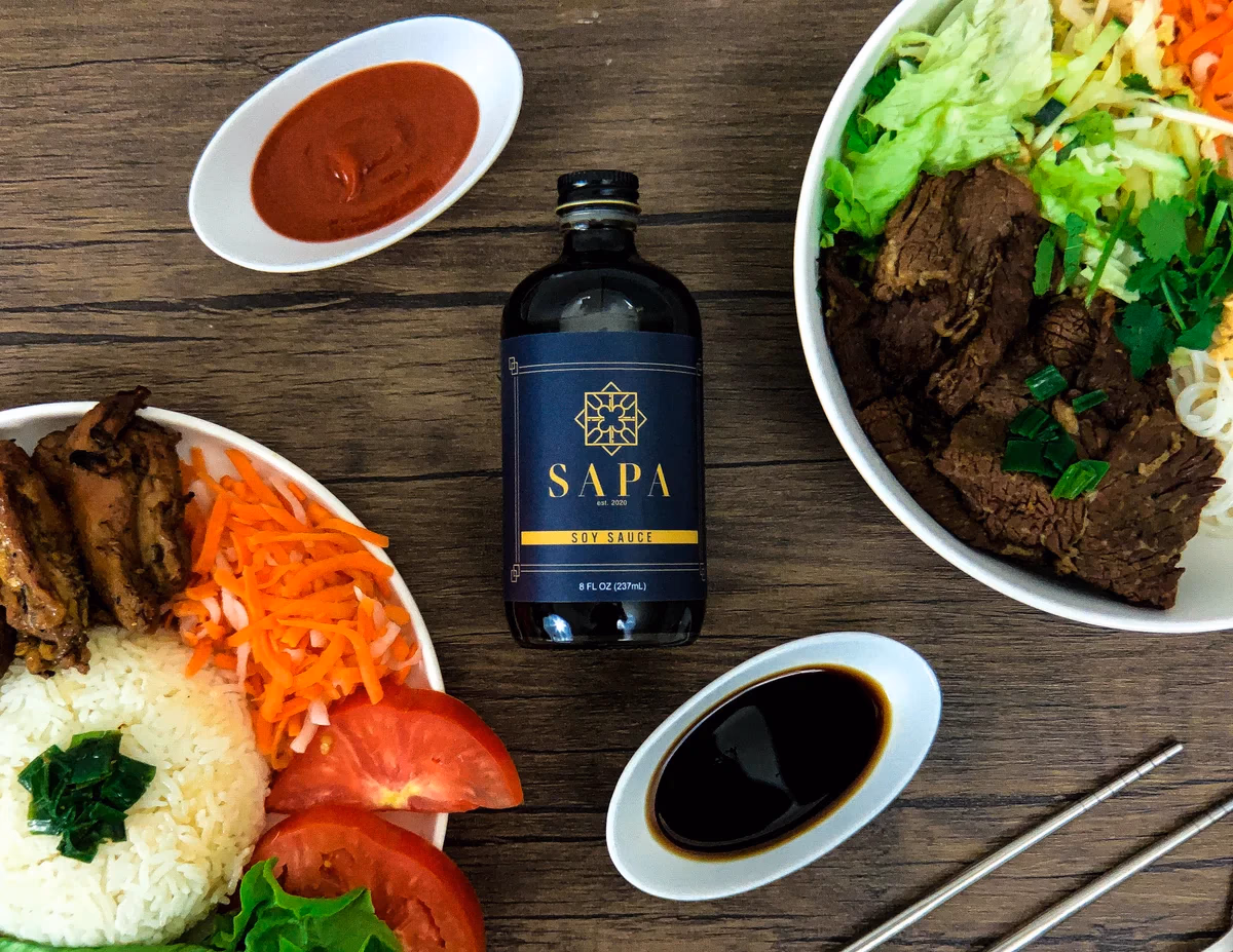 Sapa and Co sauce bottles styled on a table, photographed for Desque