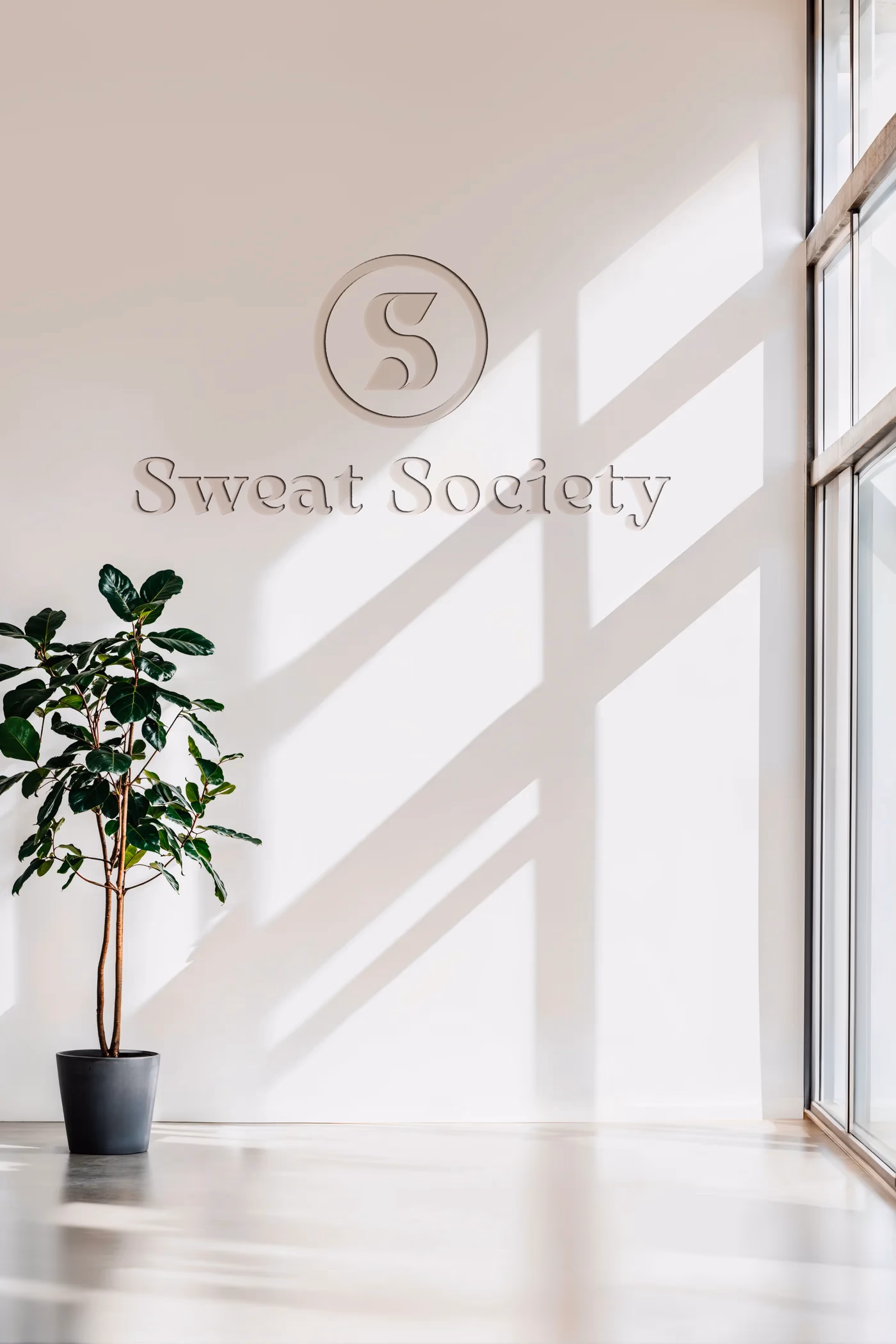 Sweat Social interior wall branding mockup designed by Desque