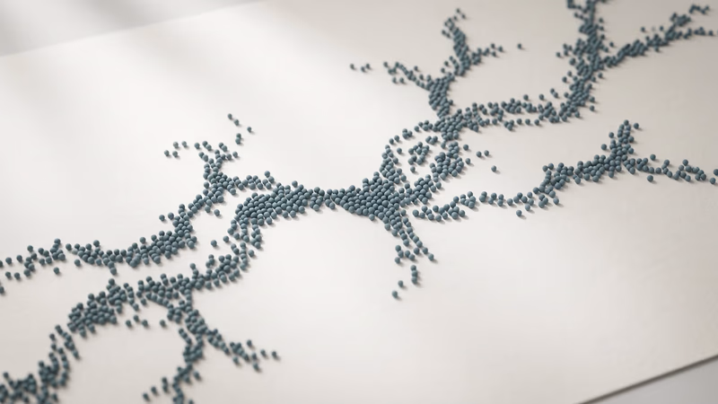 Overhead view of abstract dotted spheres forming a branching path across a pale surface, representing user behavior flow and navigation patterns on a website