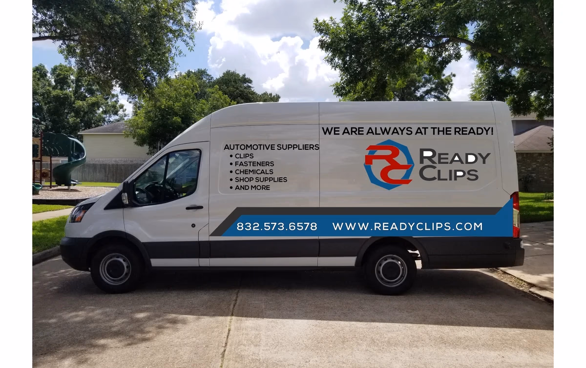 Ready Clips van left-side vehicle wrap designed by Desque, red and blue angular fleet branding
